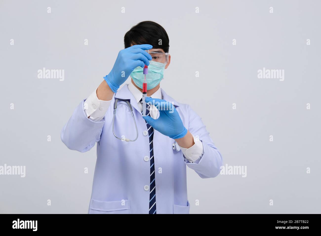 doctor physician practitioner with medicine syringe vial ampule ...