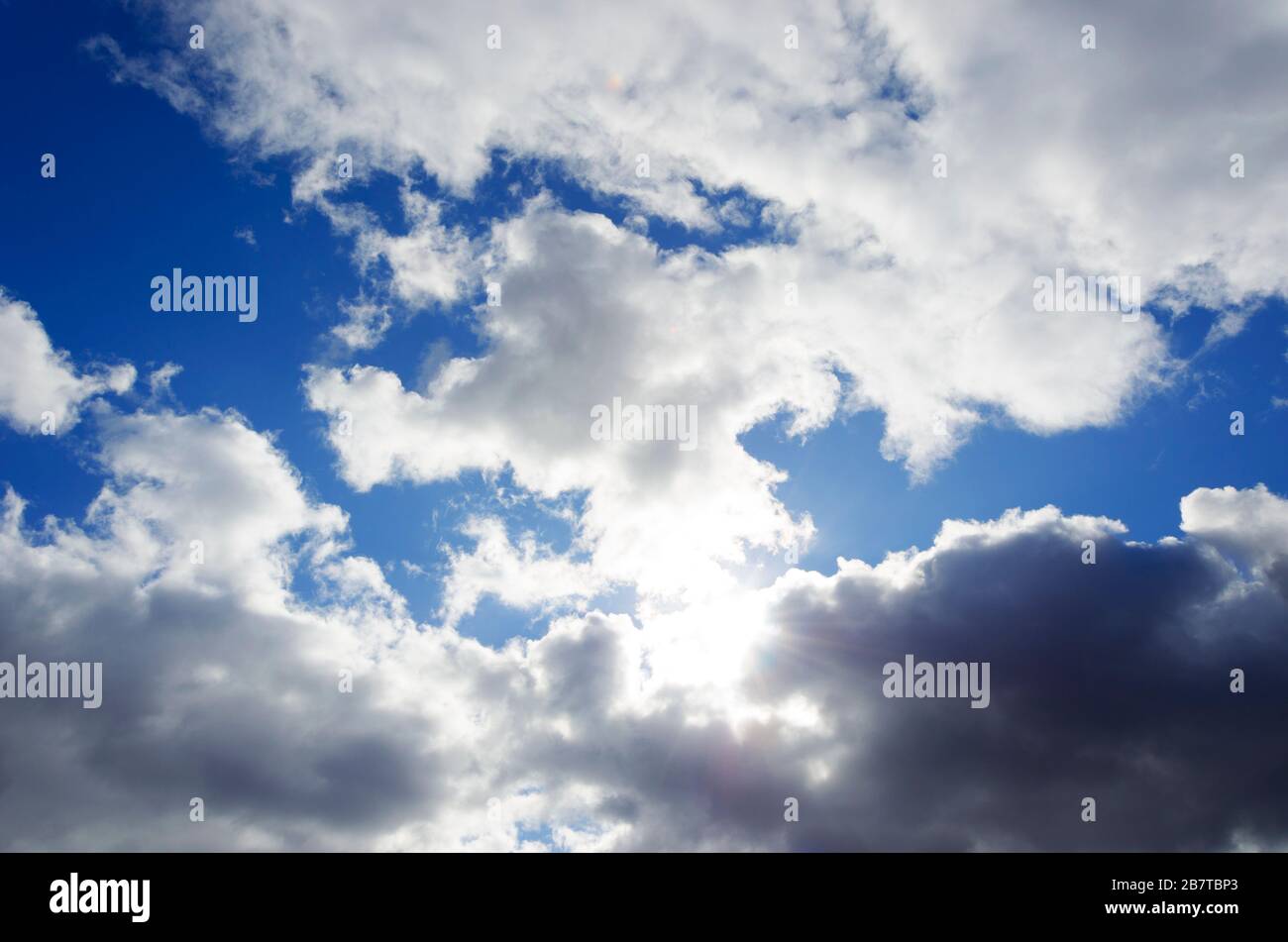 the sun peeking through the clouds Stock Photo