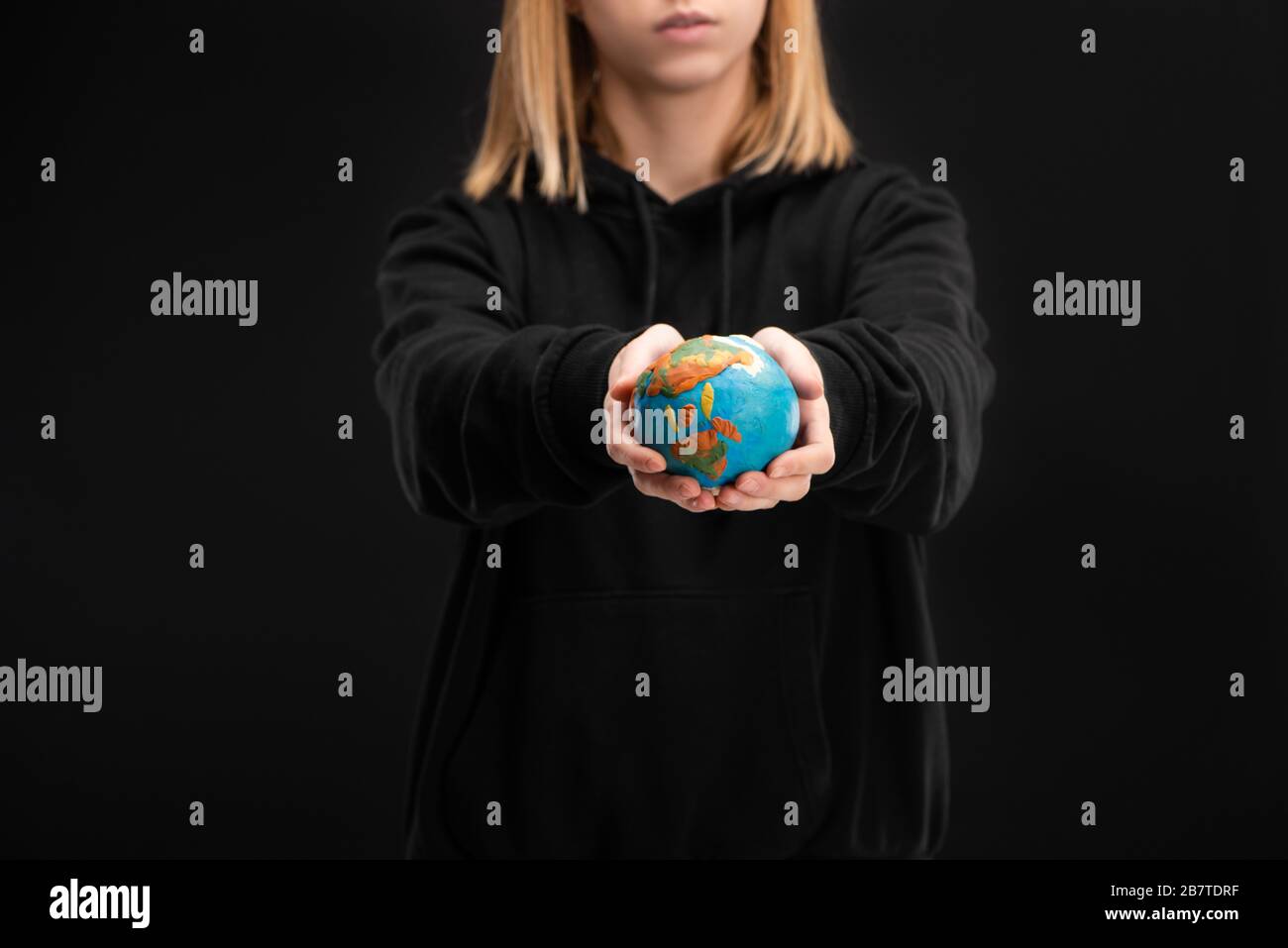 Woman holding globe on hands hi-res stock photography and images - Alamy