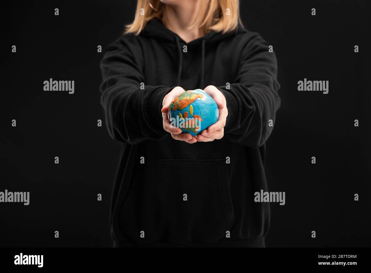 Woman holding globe on hands hi-res stock photography and images - Alamy