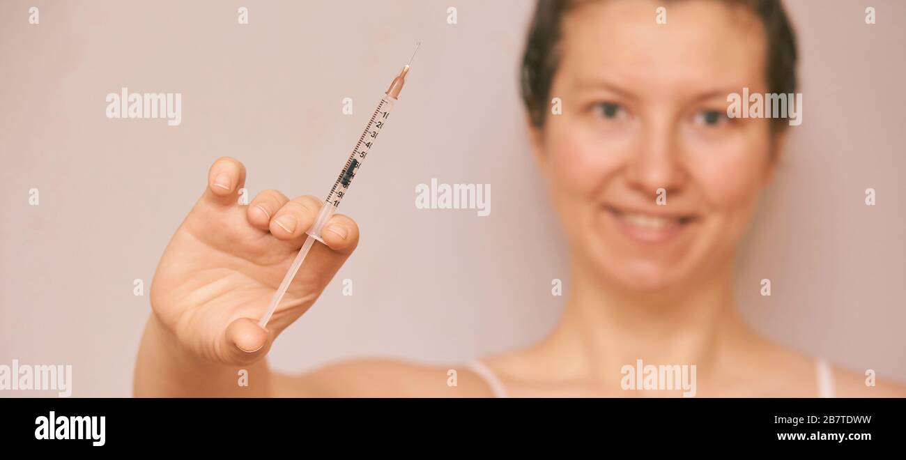 Girl hold insulin injection in hand. Blurred face Stock Photo Alamy