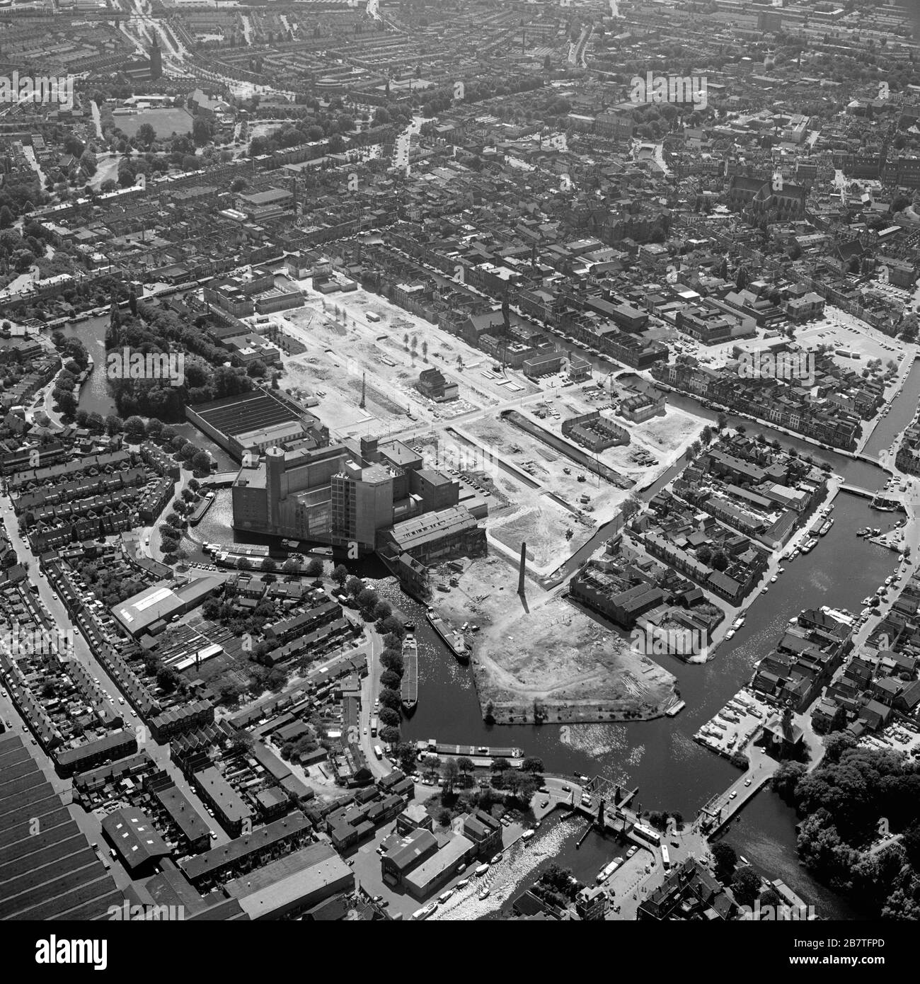Leiden, Holland, June 30 - 1976: Historical black and white aerial photo of the old flour mill De Meelfabriek,an industrial complex, Ankerpark Stock Photo
