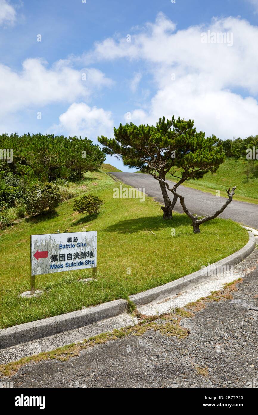 Battle Site, Mass Suicide Site, sign by road on Tokashiki Island, Okinawa, Japan Stock Photo
