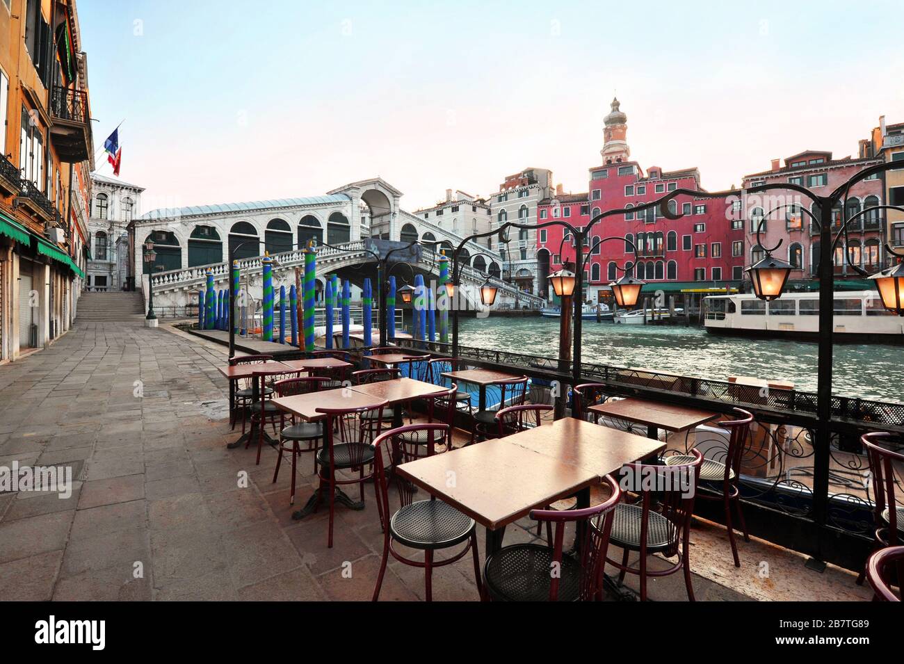 Venice in Italy - Rialto Bridge and Grand Canal with empty embankment, tourist centre of famous city without people Stock Photo