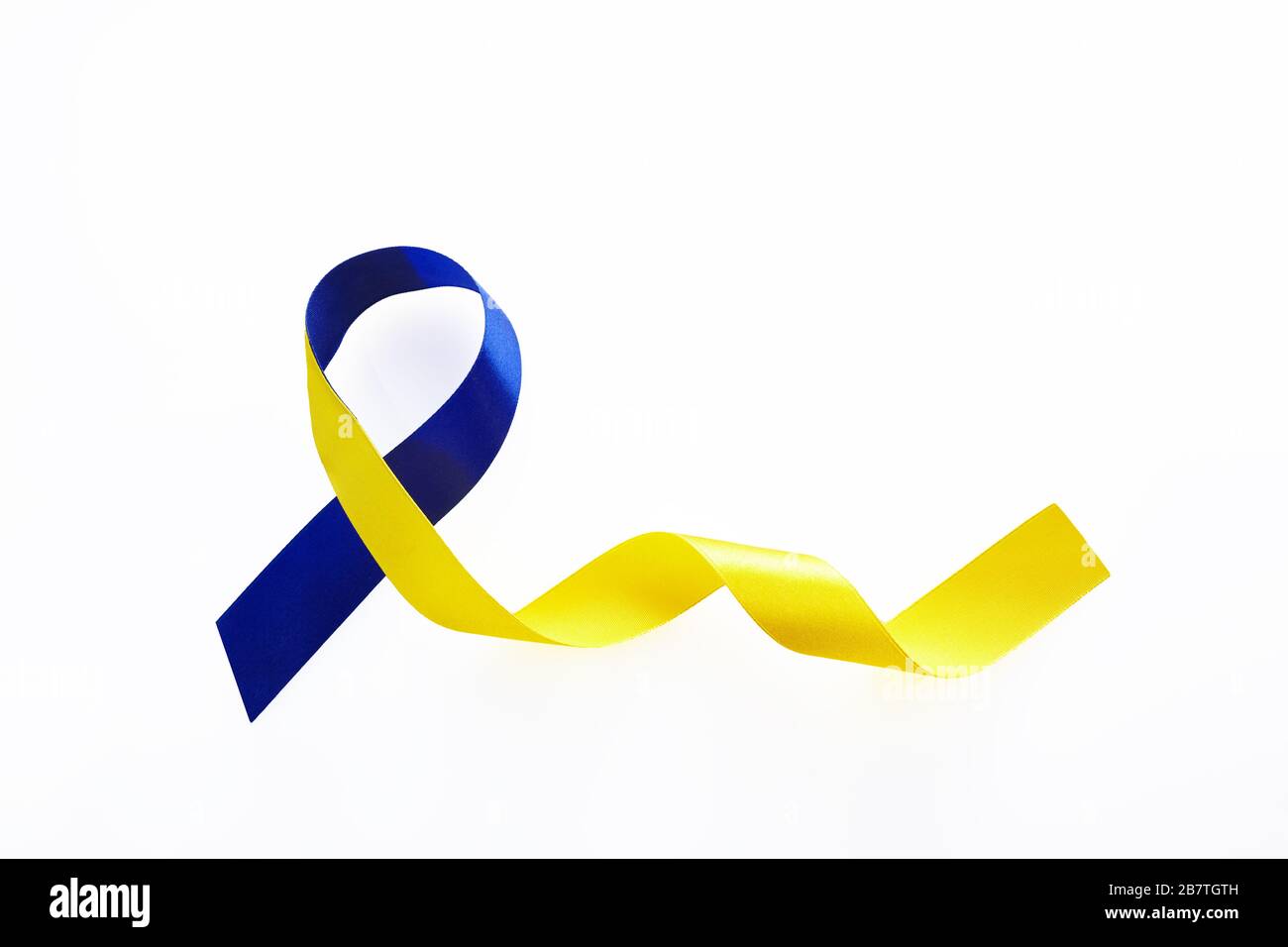 Blue and yellow ribbon on white background. World down syndrome day ...