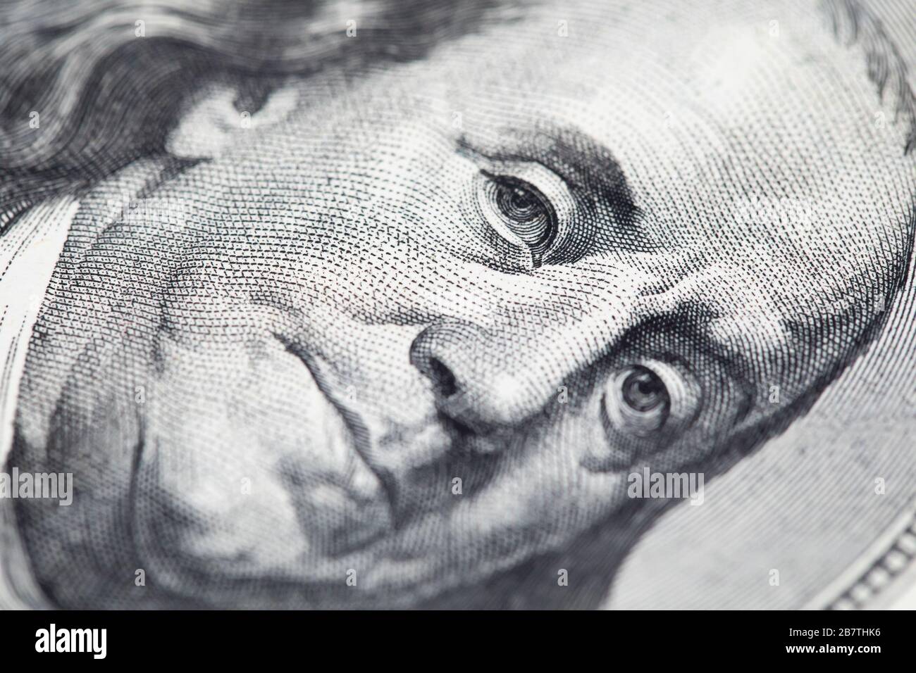 Portrait of Benjamin Franklin on 100 dollar bill macro, money concept