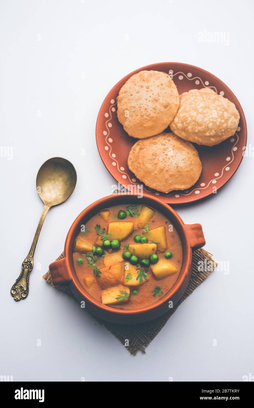 Aloo Puri or Potato curry with fried Poori, popular Indian breakfast