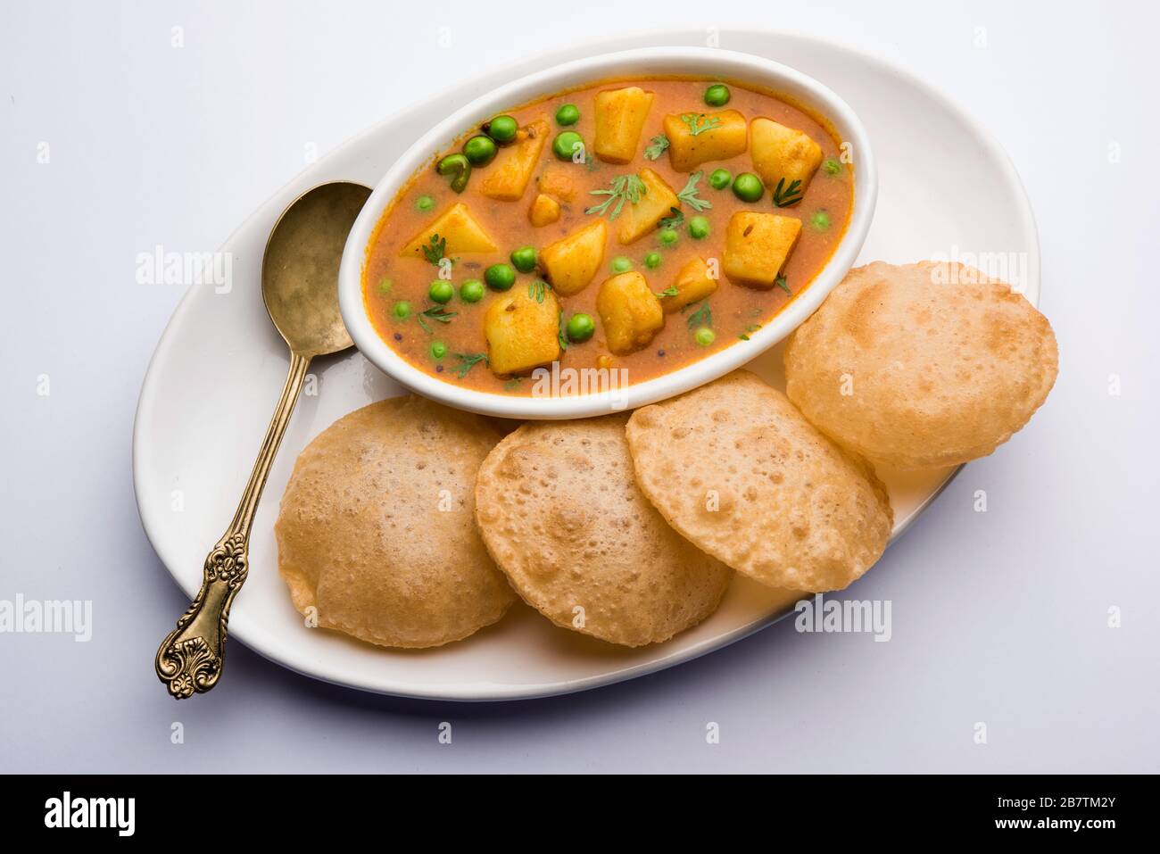 Aloo Puri or Potato curry with fried Poori, popular Indian breakfast