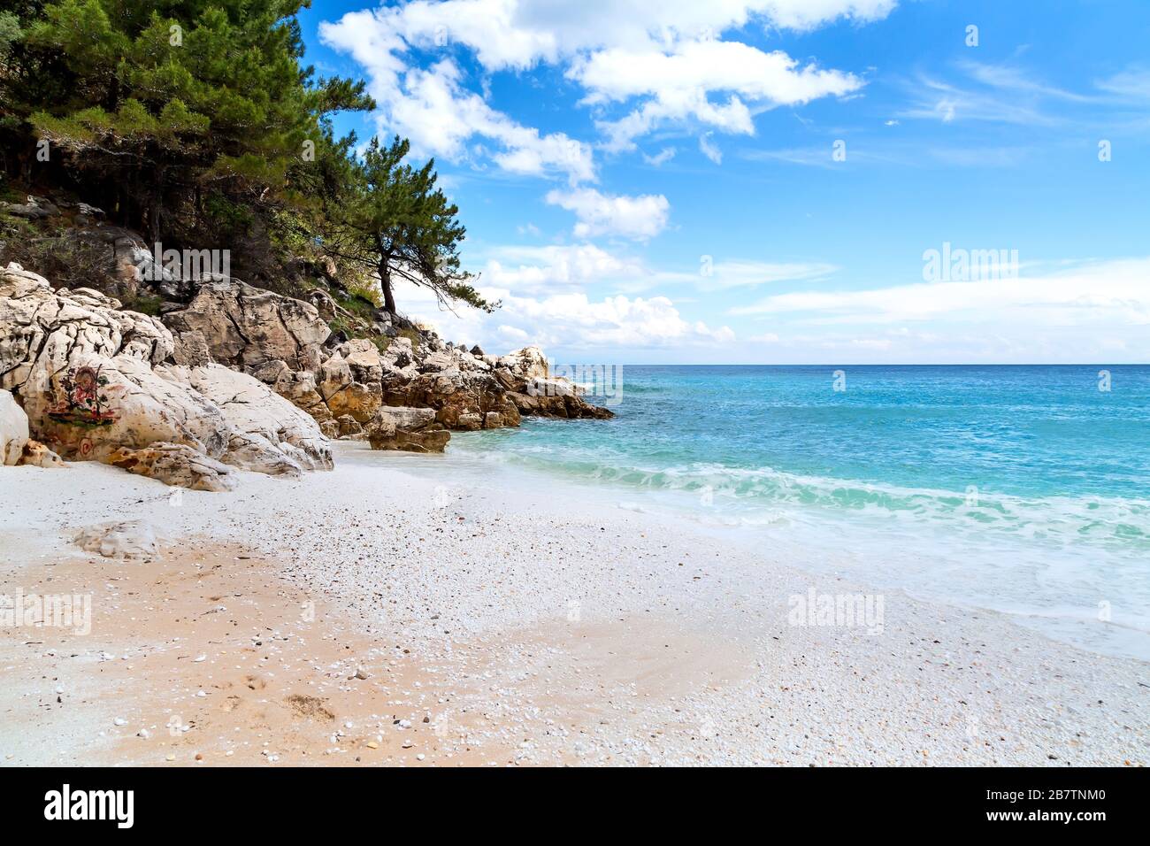 Panorama seascape with greek Marble Beach in Thassos Island, Greece with  turquoise water and pine trees Stock Photo - Alamy