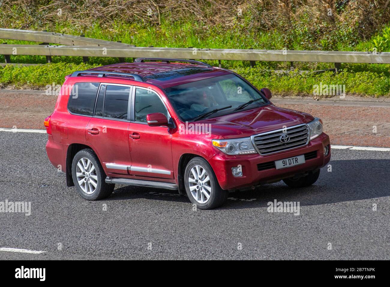 2013 Toyota Land Cruiser V8 D-4d Auto; UK vehicular traffic, transport, moving vehicles, vehicle, roads, motors, motoring  on the M6 motorway highway Stock Photo