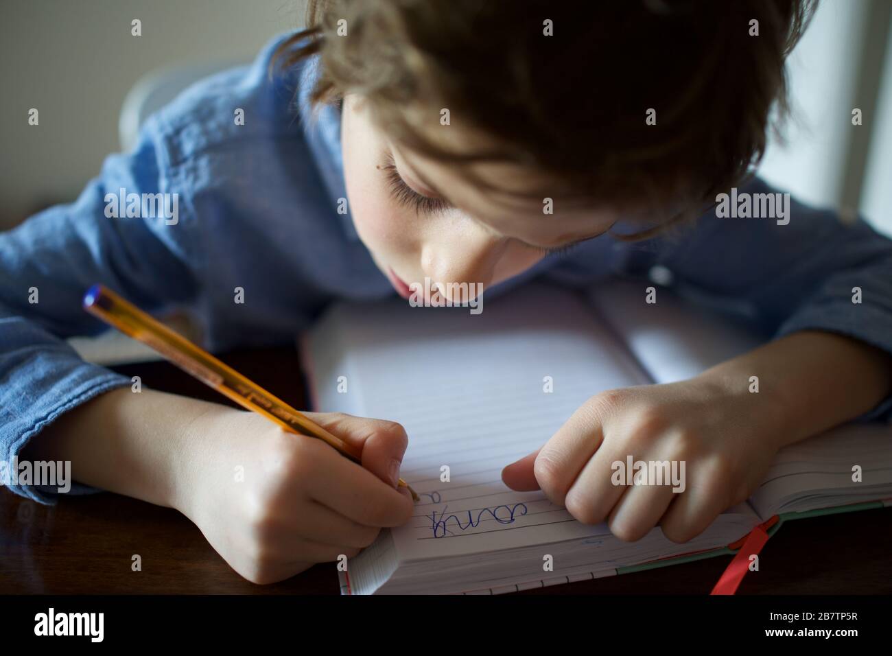 Child being homeschooled during the Coronavirus pandemic Stock Photo