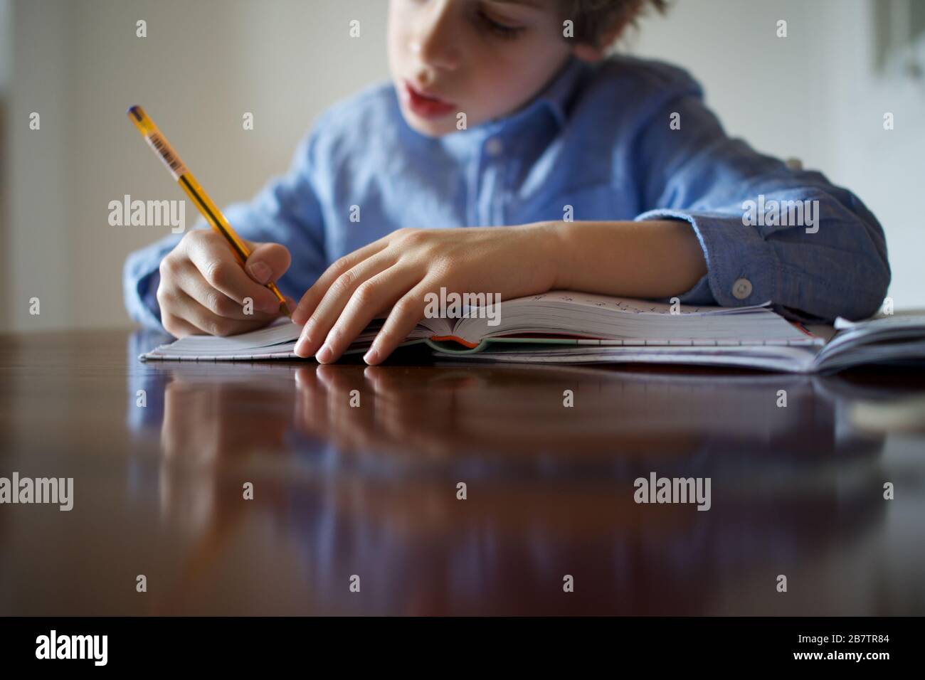 Child being homeschooled during the Coronavirus pandemic Stock Photo