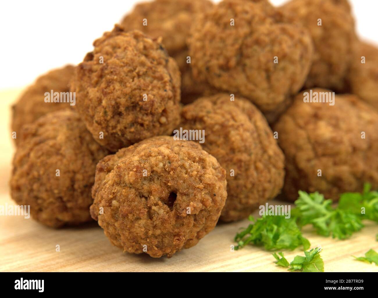 Fried meatballs on a wooden plate Stock Photo
