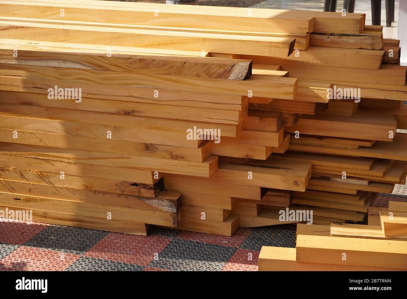 Furniture, doors, windows frame, and tables at factory. Wood cutting for making a door frame, window frame for using in building houses, business. Cut Stock Photo