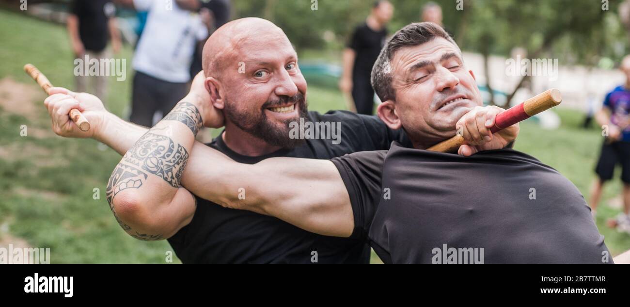 Instructor and student practice filipino escrima stick fighting technique. Martial  arts demonstration Stock Photo - Alamy