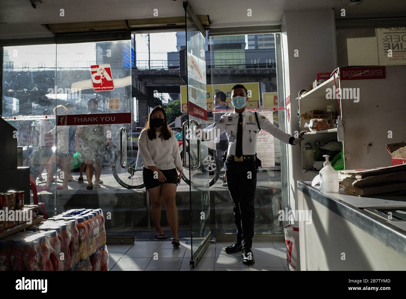 Philippines. 18th Mar, 2020. Customers enter a drugstore in Mandaluyong