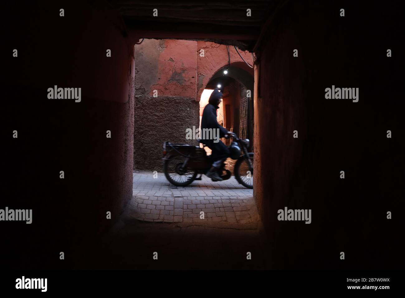 Man on moped Jmaa el-Fnaa Main Square Marrakesh Medina Stock Photo