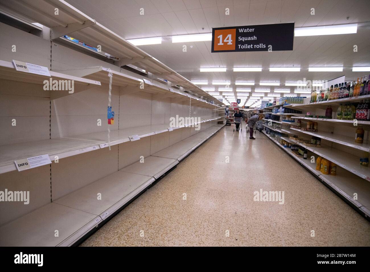 Empty shelves where toilet rolls should be in a Sainsbury's supermarket in Taunton, Somerset as panic buying continues during the Coronavirus outbreak. Stock Photo