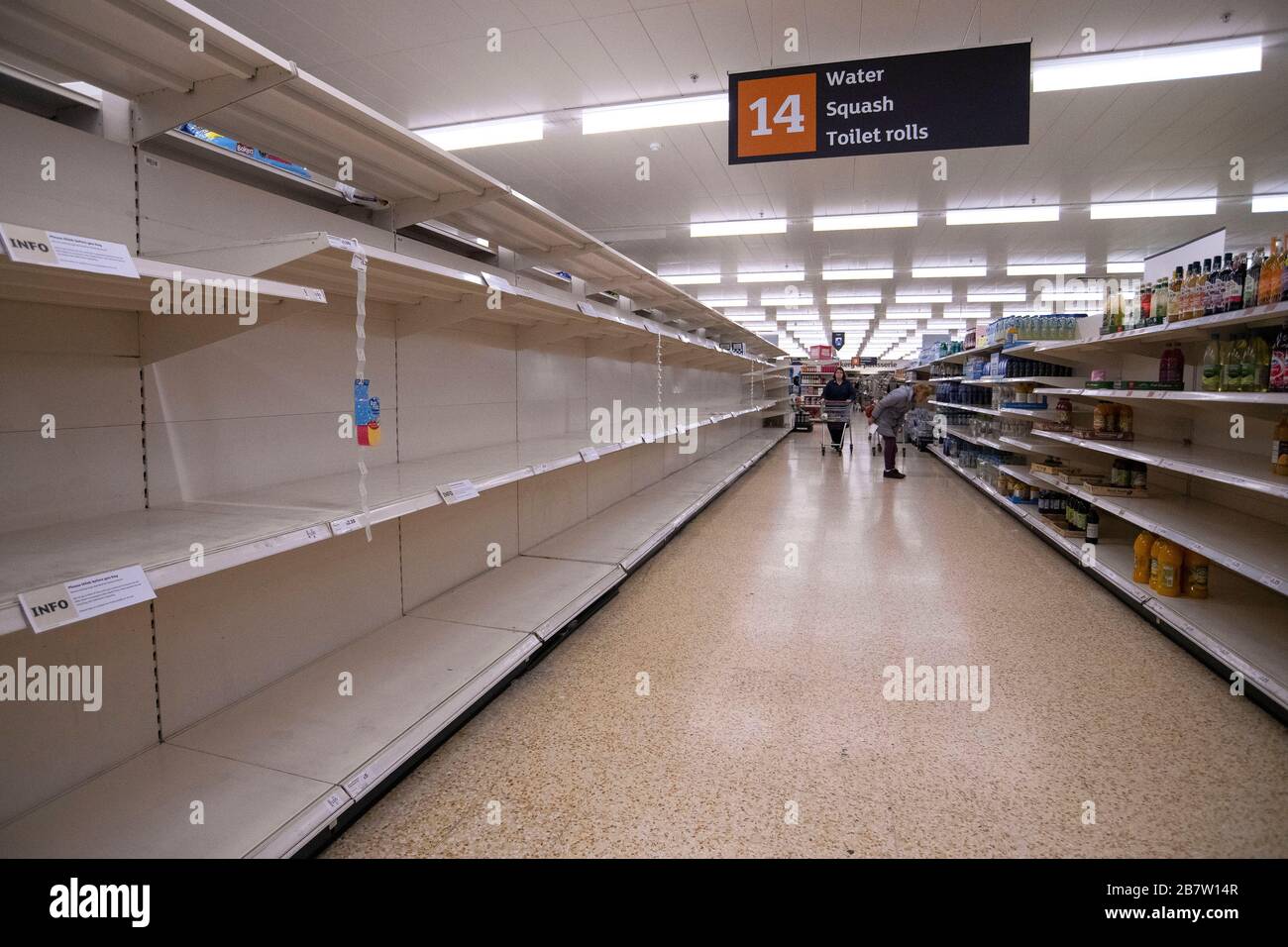 Empty shelves where toilet rolls should be in a Sainsbury's supermarket in Taunton, Somerset as panic buying continues during the Coronavirus outbreak. Stock Photo