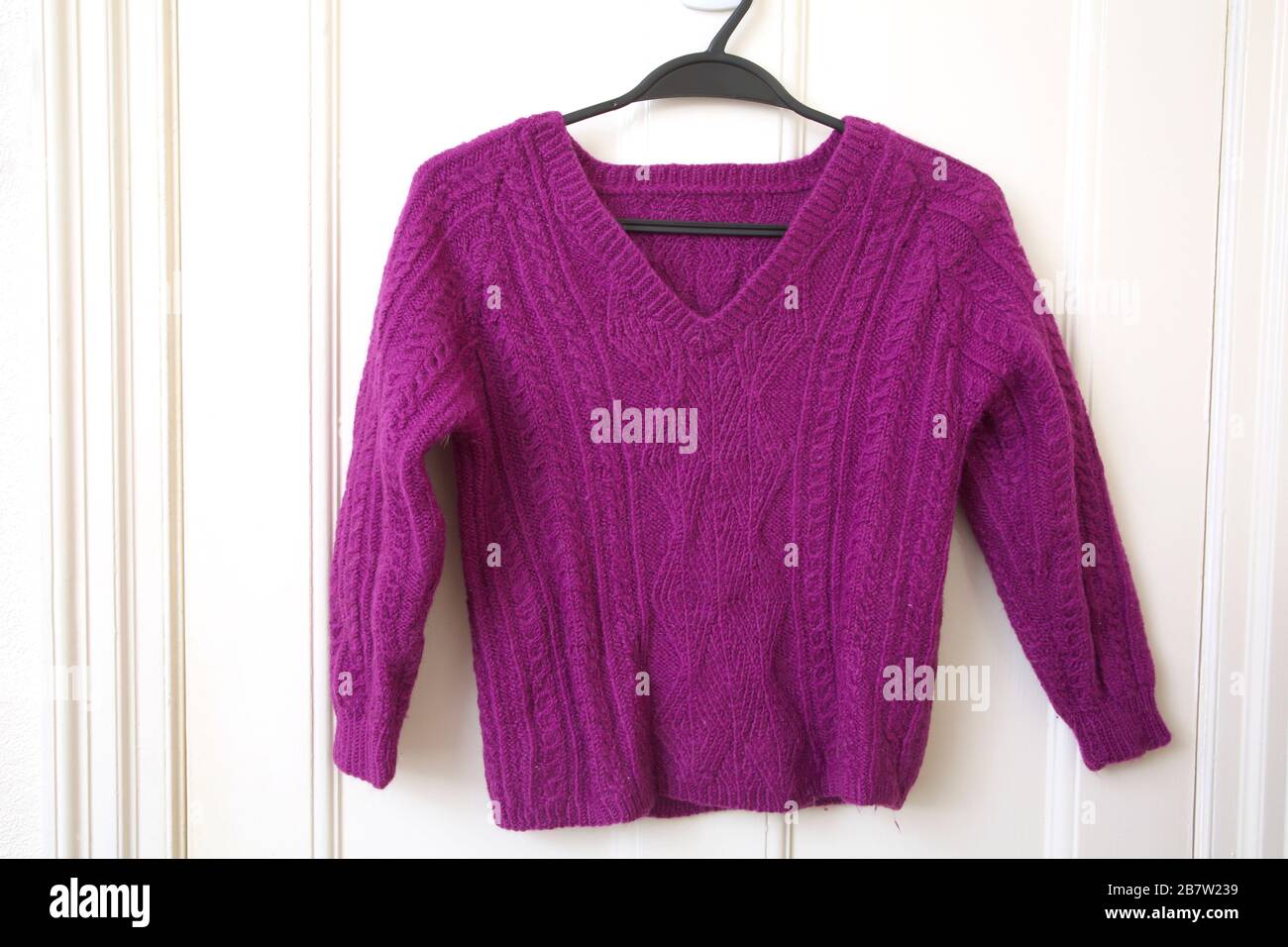 Hand Knitted Purple Cable Knit Jumper Stock Photo