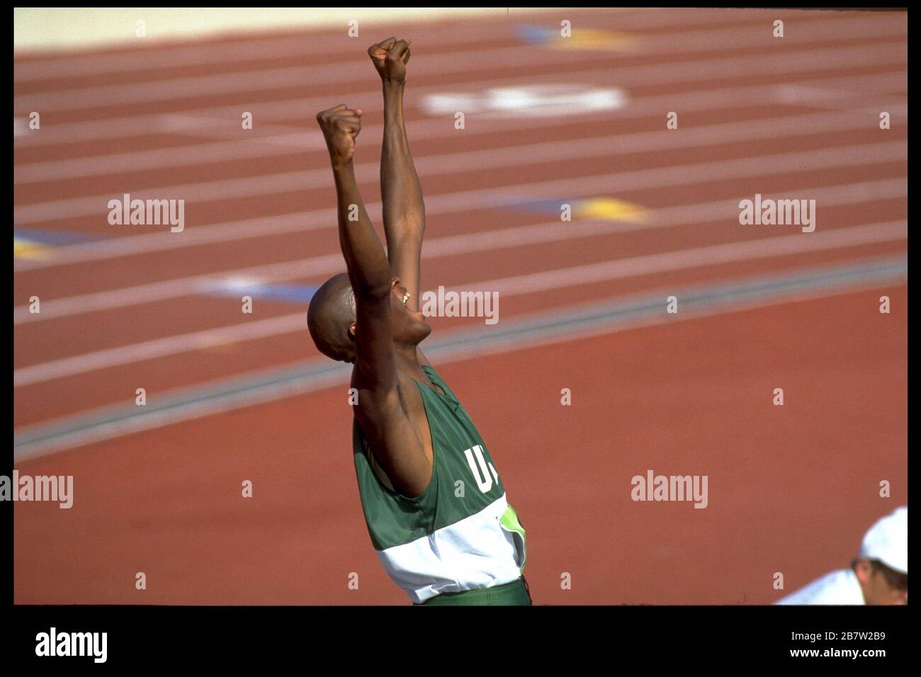 Young Black athlete celebrates after clearing bar in men's high jump competition at U.S. Olympic Sports Festival. ©Bob Daemmrich Stock Photo