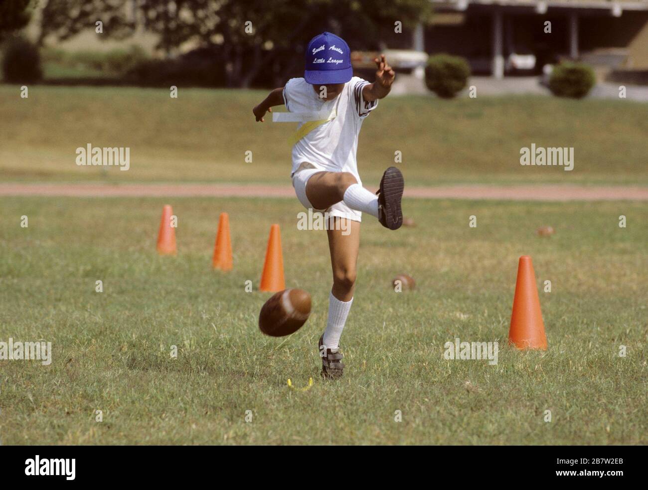 Austin, Texas USA Tenyearold boy kicks football during football