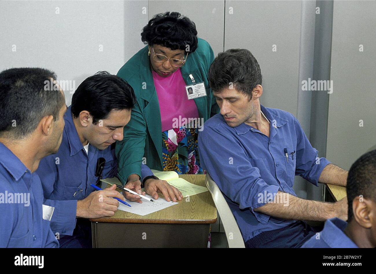 Texas:  Teacher working with inmates in private prison.  MR ©Bob Daemmrich Stock Photo