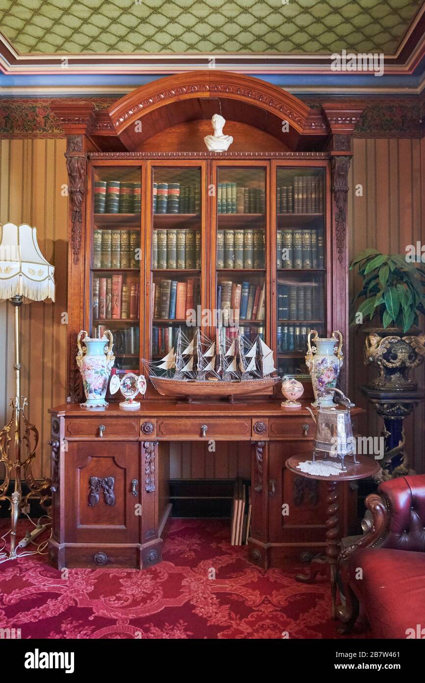 Wood bookcase at the Crawley mansion. At the Monte Cristo Colonial Homestead Museum in Junee, NSW, Australia. Stock Photo