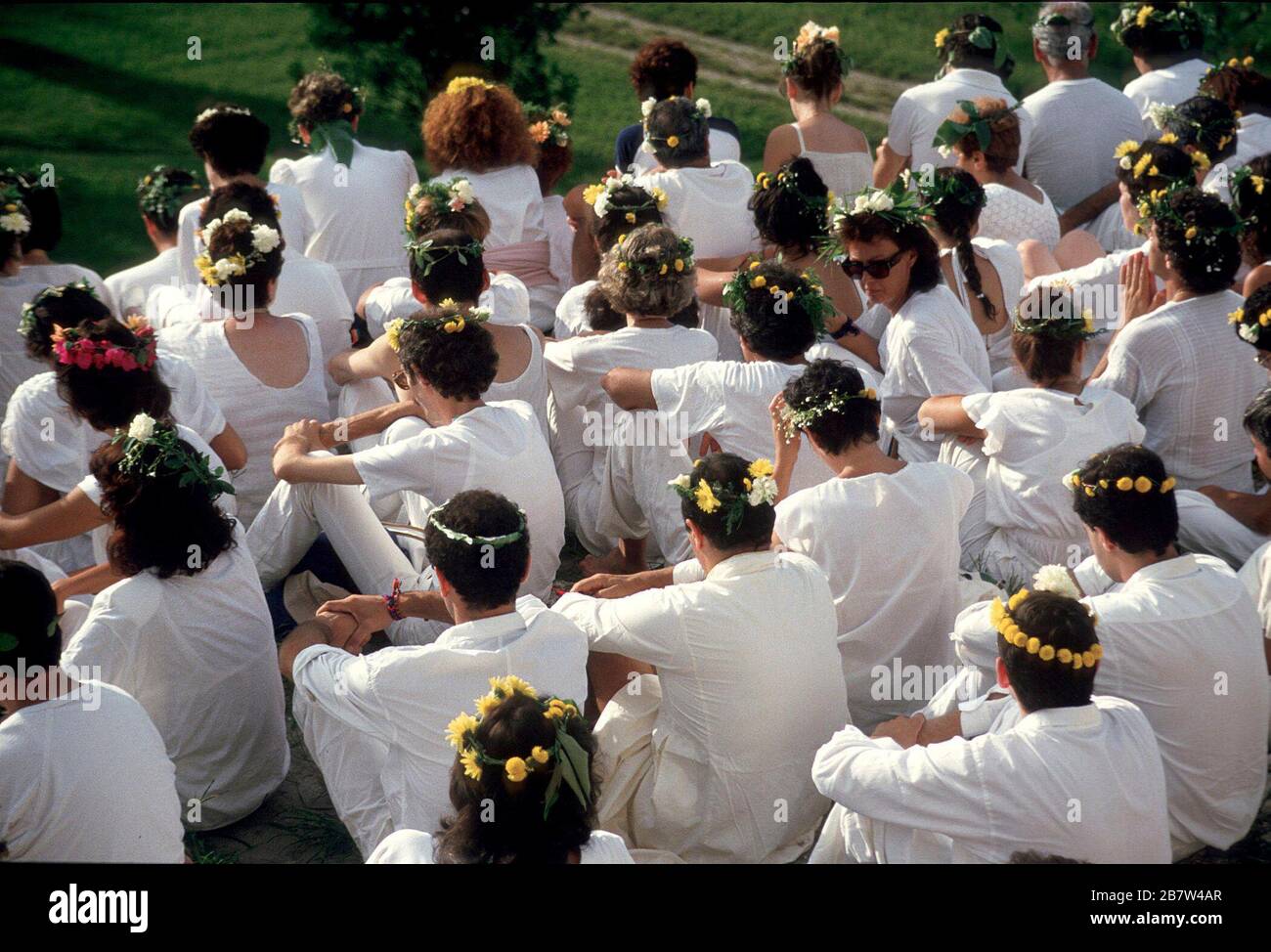 Palenque, Chiapas, Mexico, August 1987:  Italians wearing flowers in their hair at Mayan ruins in Palenque during harmonic convergence. ©Bob Daemmrich Stock Photo