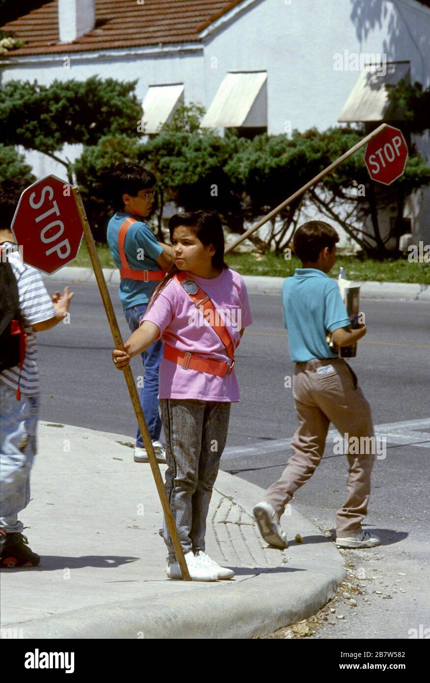 San Antonio Texas USA: Elementary school children obey school crossing guards to safely crossing street after school.  ©Bob Daemmrich Stock Photo