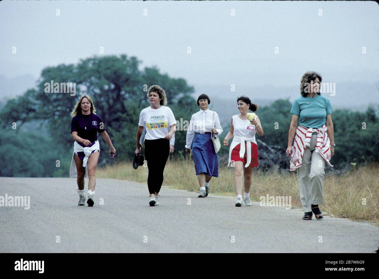 Boerne Texas USA:  Women participate in a Volksmarch, an organized walk for exercise and fun, on a county road near Boerne.  ©Bob Daemmrich Stock Photo