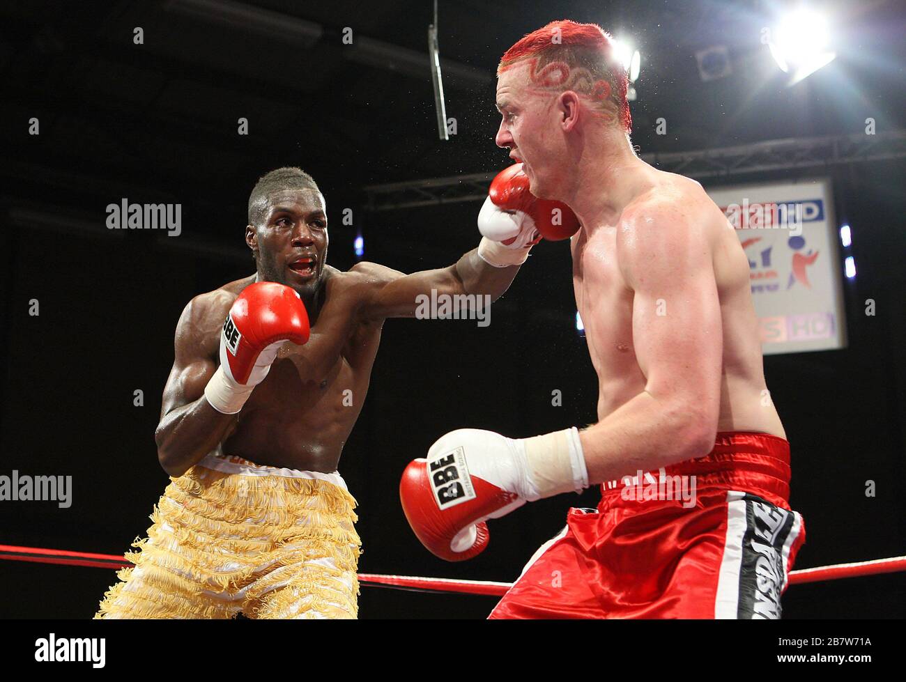 Menay Edwards (gold shorts) defeats Hari Miles in a Light-Heavyweight ...
