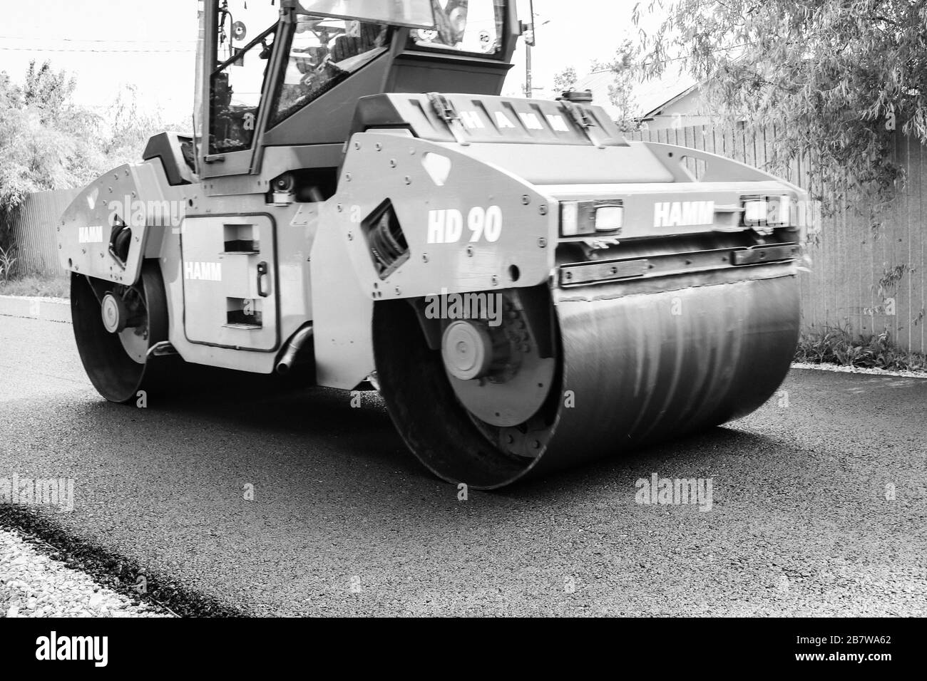 Asphalt Inmotion Asphalt paving street using heavy Black and White Stock Photos & Images ...