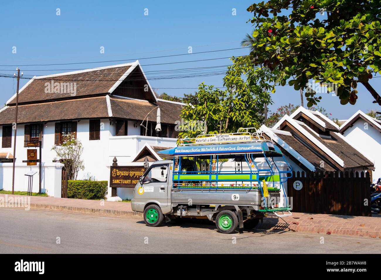 Sanctuary Hotel, with tuk tuk waiting for tourists, Luang Prabang, Laos Stock Photo