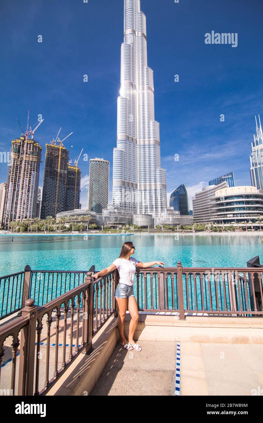 Tourist woman enjoying the view of the Burj Khalifa skyscraper and the