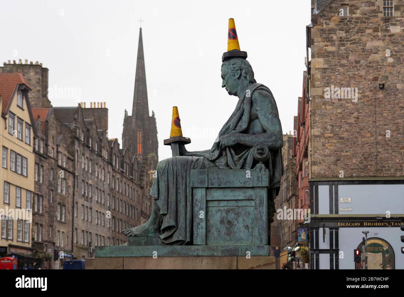 Edinburgh, Scotland, UK. 18 March 2020.Traffic cones placed on statue of David Hume on the Royal Mile in Edinburgh. Iain Masterton/Alamy Live News. Stock Photo