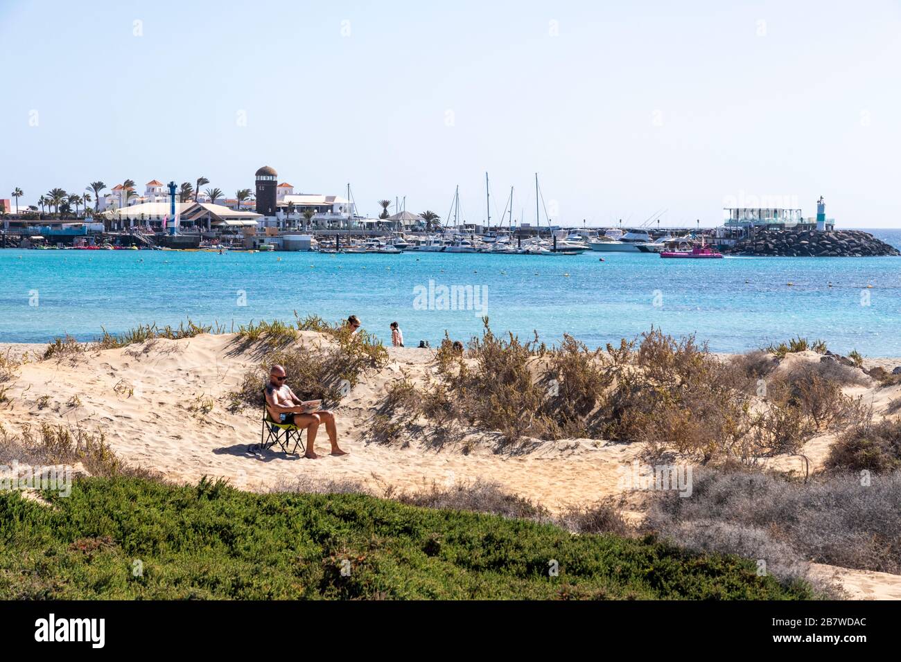 Looking across to the harbour at Caleta de Fuste on the east coast of the Canary Island of Fuerteventura Stock Photo