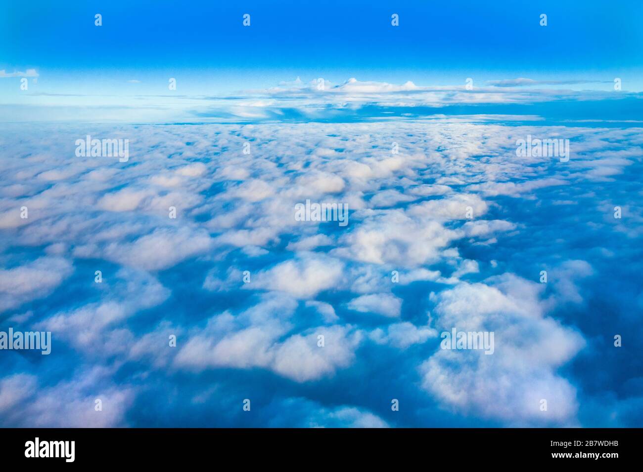 A cloudscape from an aircraft window somewhere over southern England Stock Photo