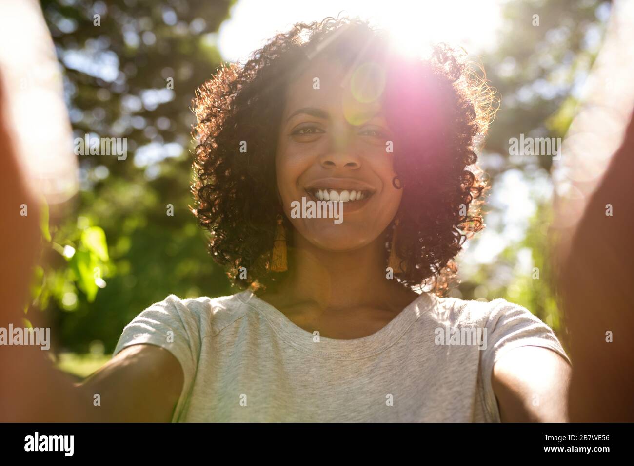 Smiling woman taking a selfie on a hi-res stock photography and images ...
