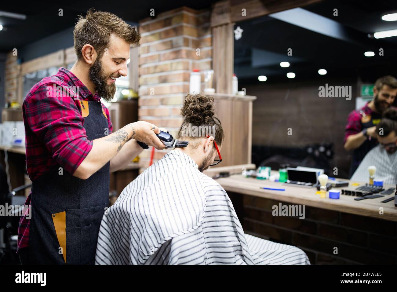 Client during beard and moustache grooming in barber shop Stock Photo Alamy