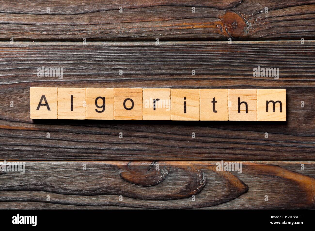 Algorithm word written on wood block. Algorithm text on wooden table ...