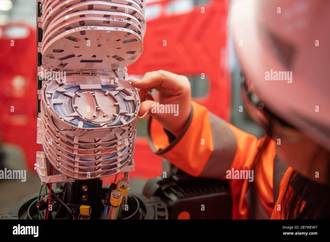 An Openreach engineer inpsecting fibre optic cables at the Openreach