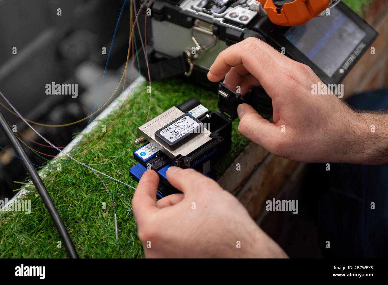 An openreach engineer splicing fibre optic cables openreach training