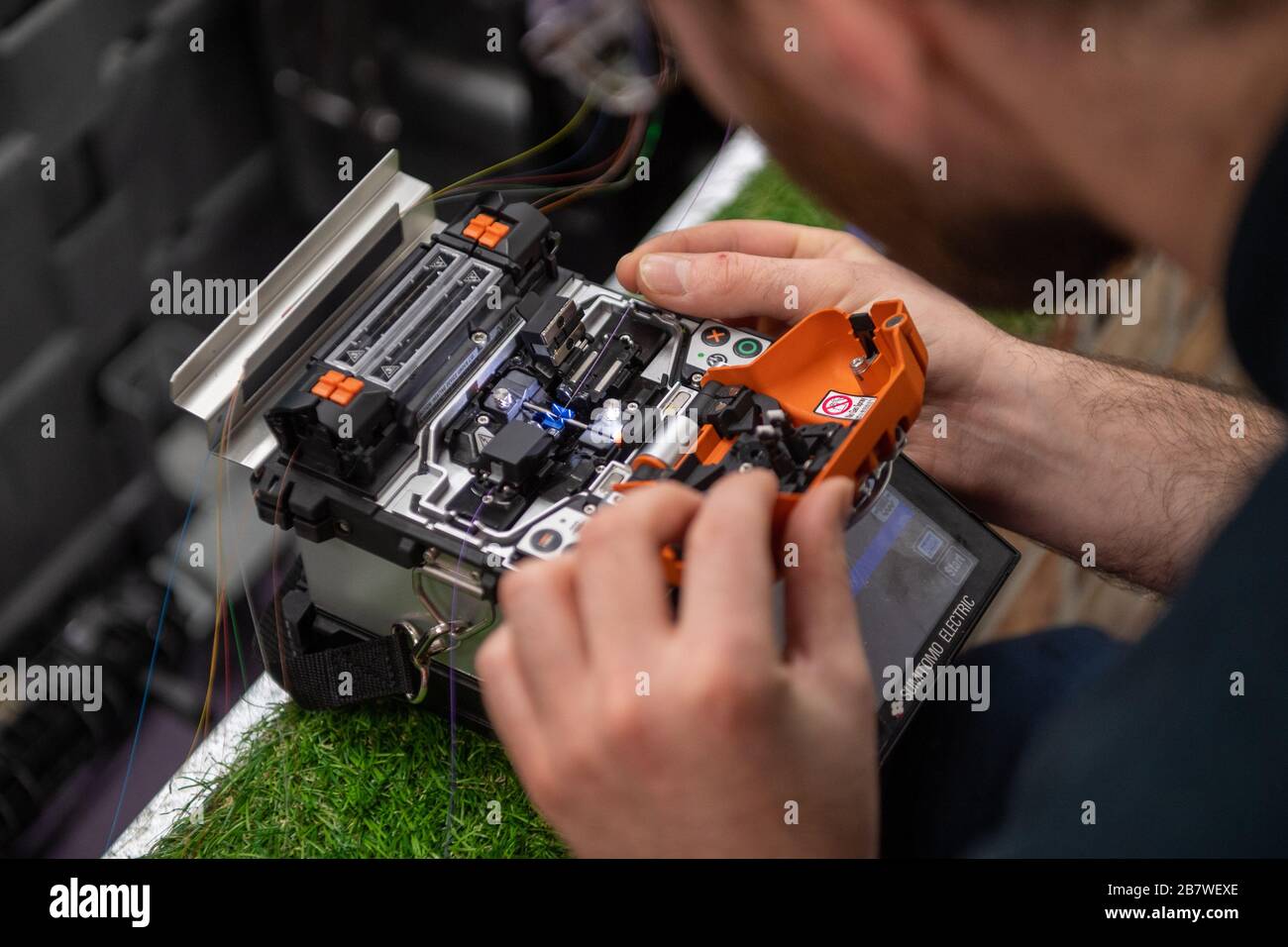 An openreach engineer splicing fibre optic cables openreach training