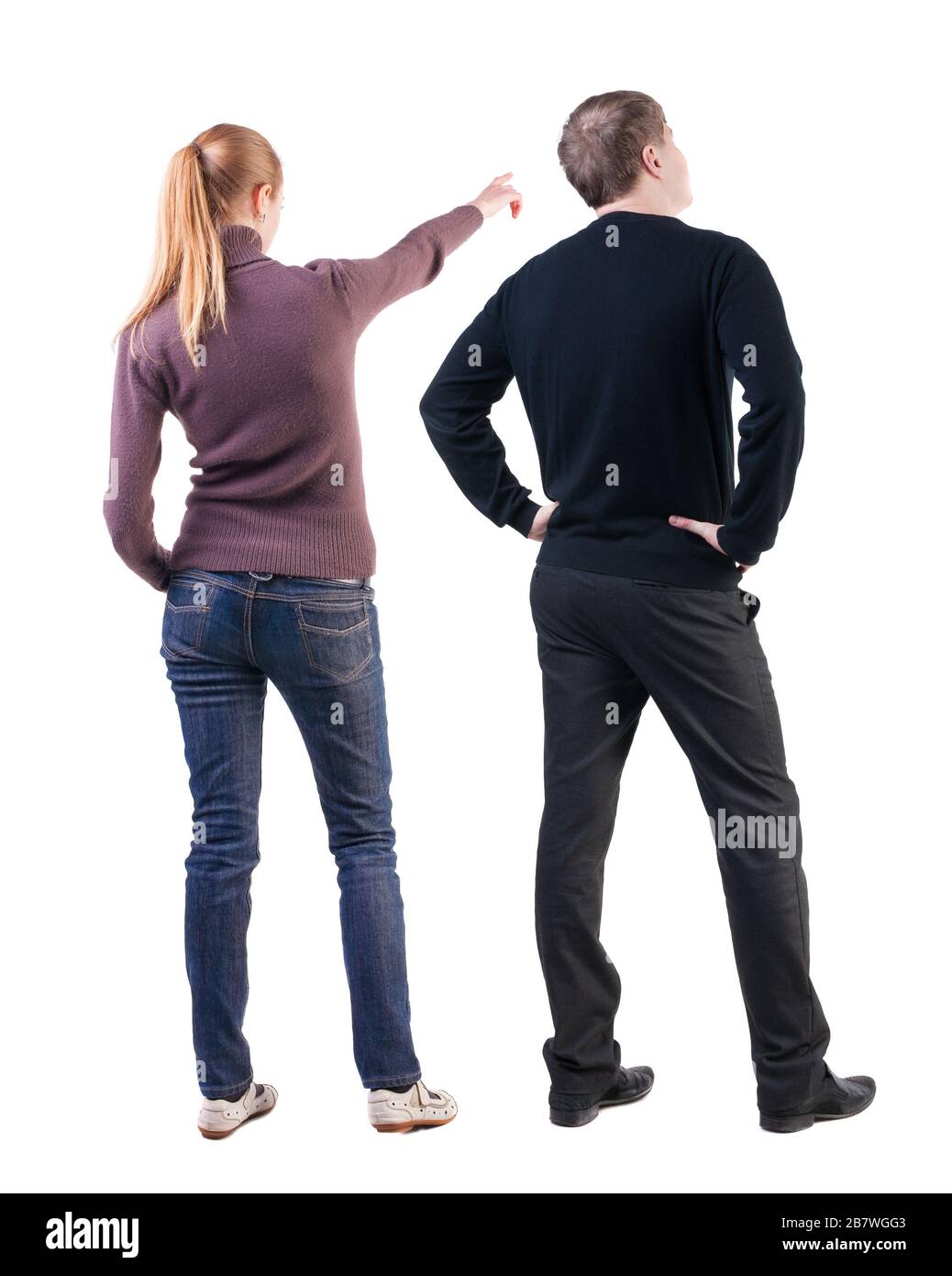 Back view of couple in sweater pointing. Rear view people collection ...