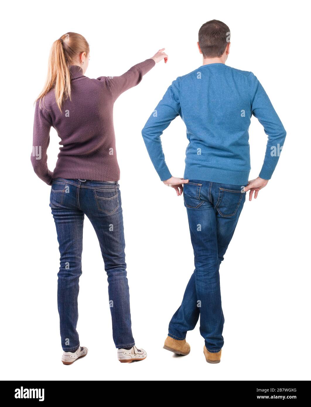 Back view of couple in sweater pointing. Rear view people collection ...