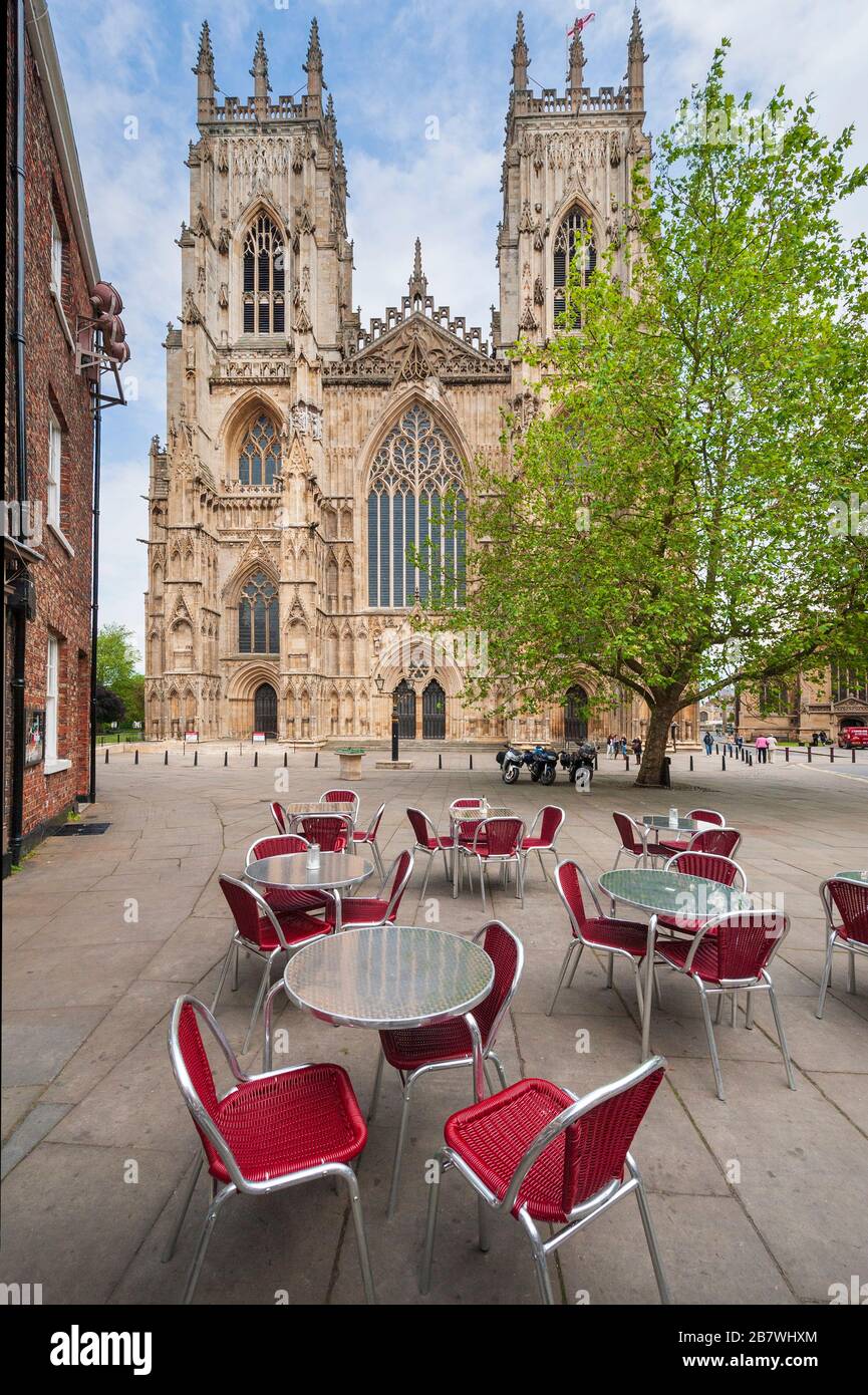 Pavement cafe below the western towers and west facade of York Minster Gothic cathedral Stock Photo
