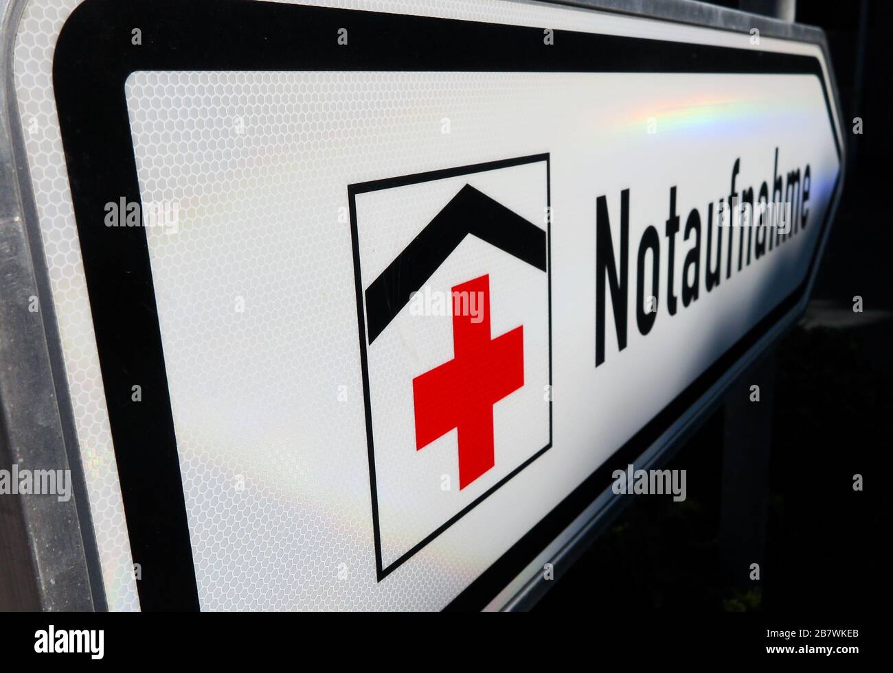 Isolated direction sign with red cross for hospital emergency
