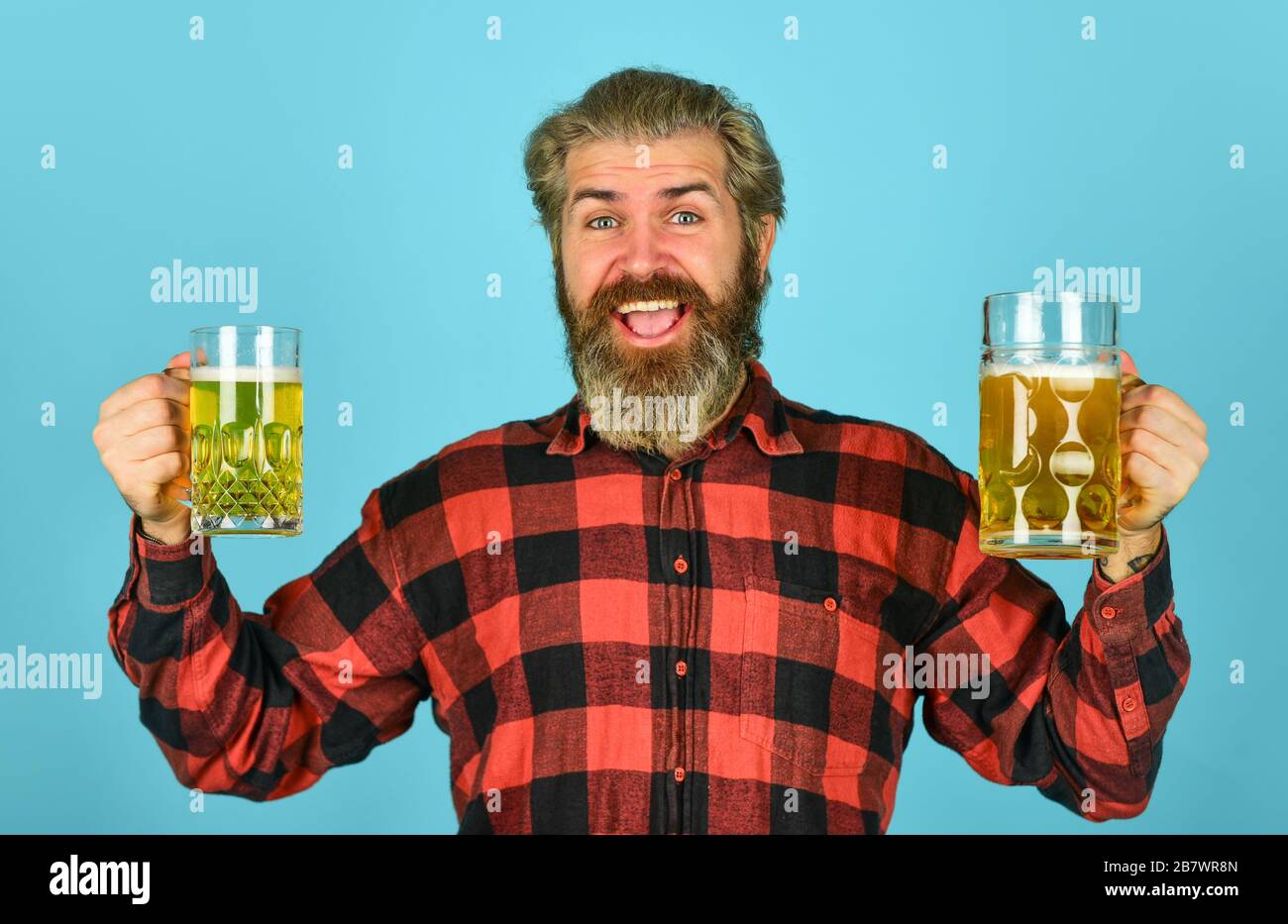 what to choose. Man drinking beer in pub bar. Beer with foam. brutal hipster drink beer. mature bearded barman hold beer glass. confident bartender raising toast. leisure and celebration. Stock Photo