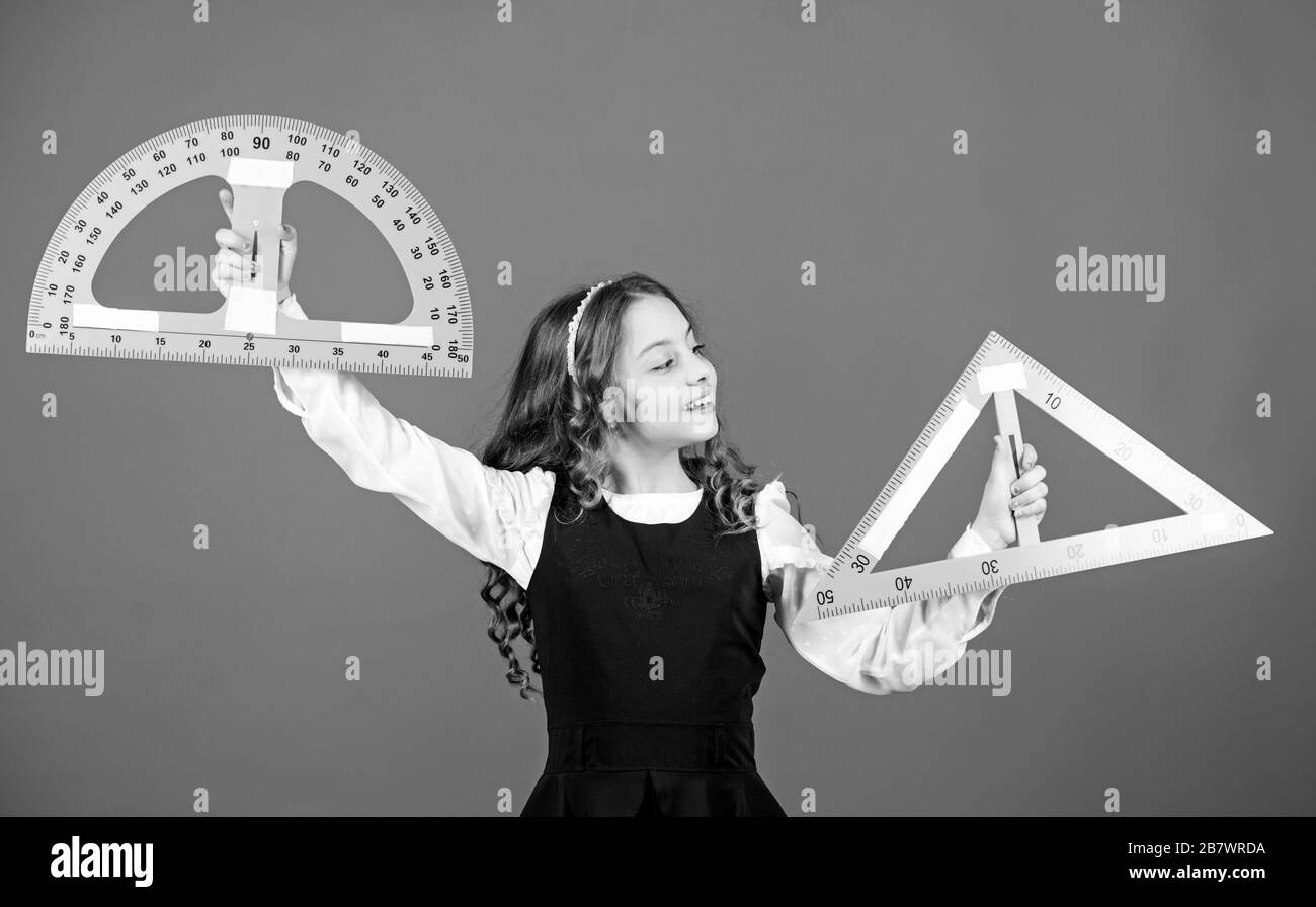 Smart and clever concept. Girl with big ruler. School student study